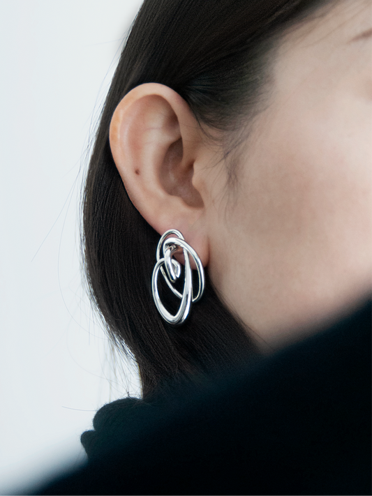 Space Within Earrings with sculptural form.