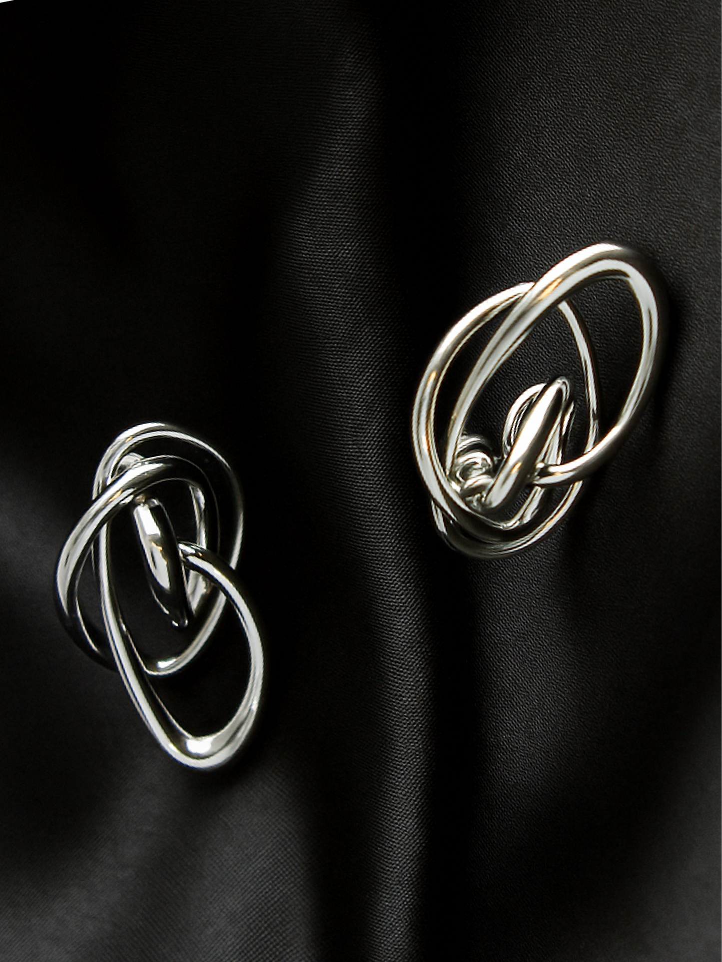 Earrings with fluid structural form designed by nood