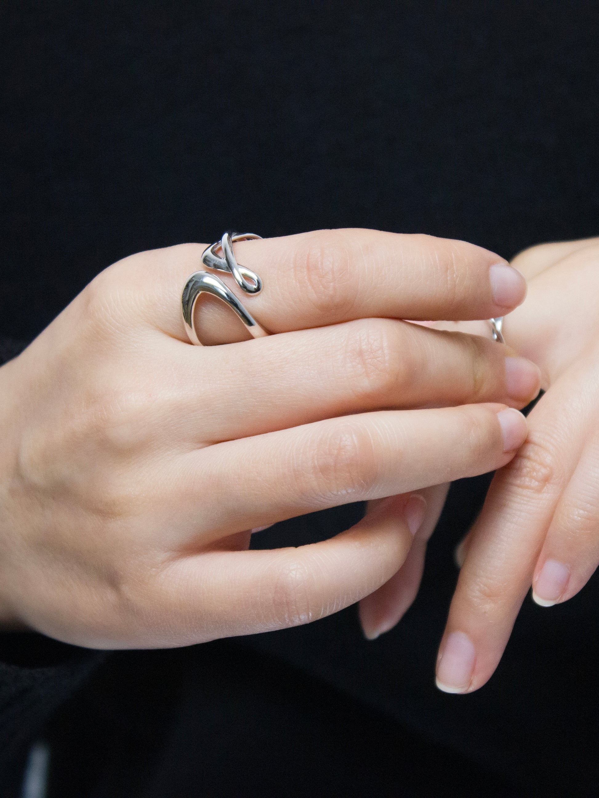 nood Leap Ring, a sculptural silver ring with lifted flowing curves, designed through 3D modeling and cast in metal