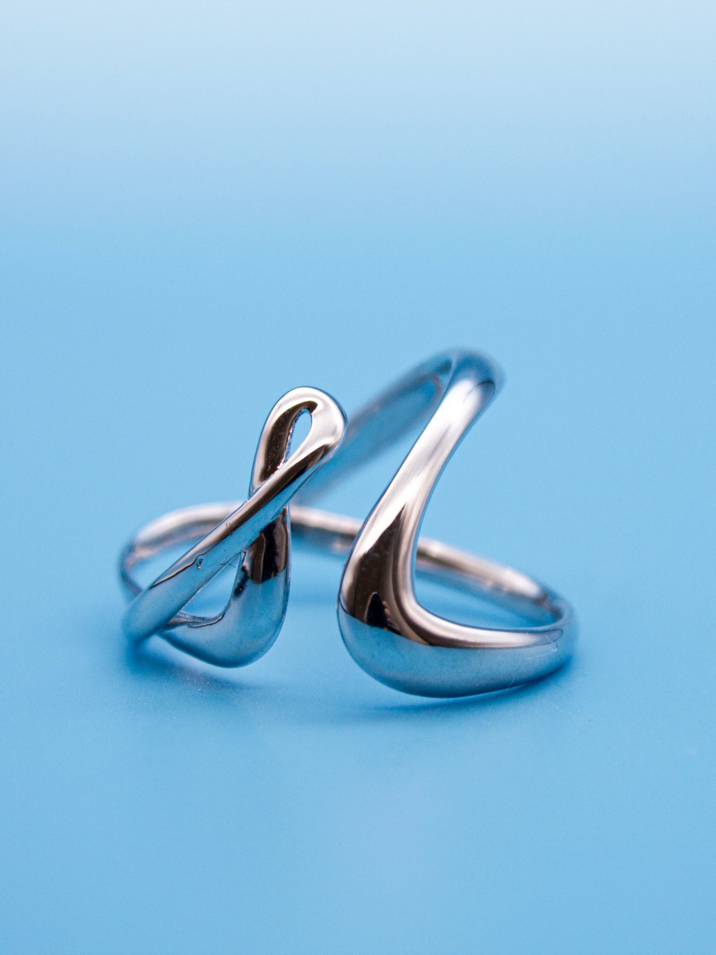 nood Leap Ring, a sculptural silver ring with lifted flowing curves, designed through 3D modeling and cast in metal