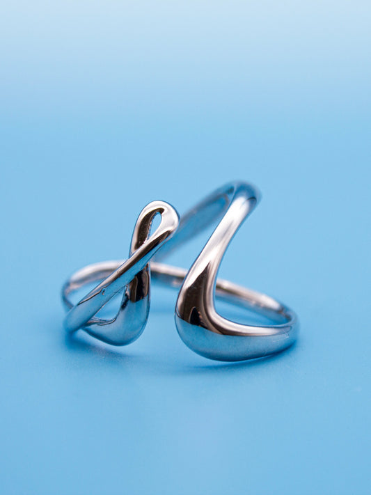 nood Leap Ring, a sculptural silver ring with lifted flowing curves, designed through 3D modeling and cast in metal